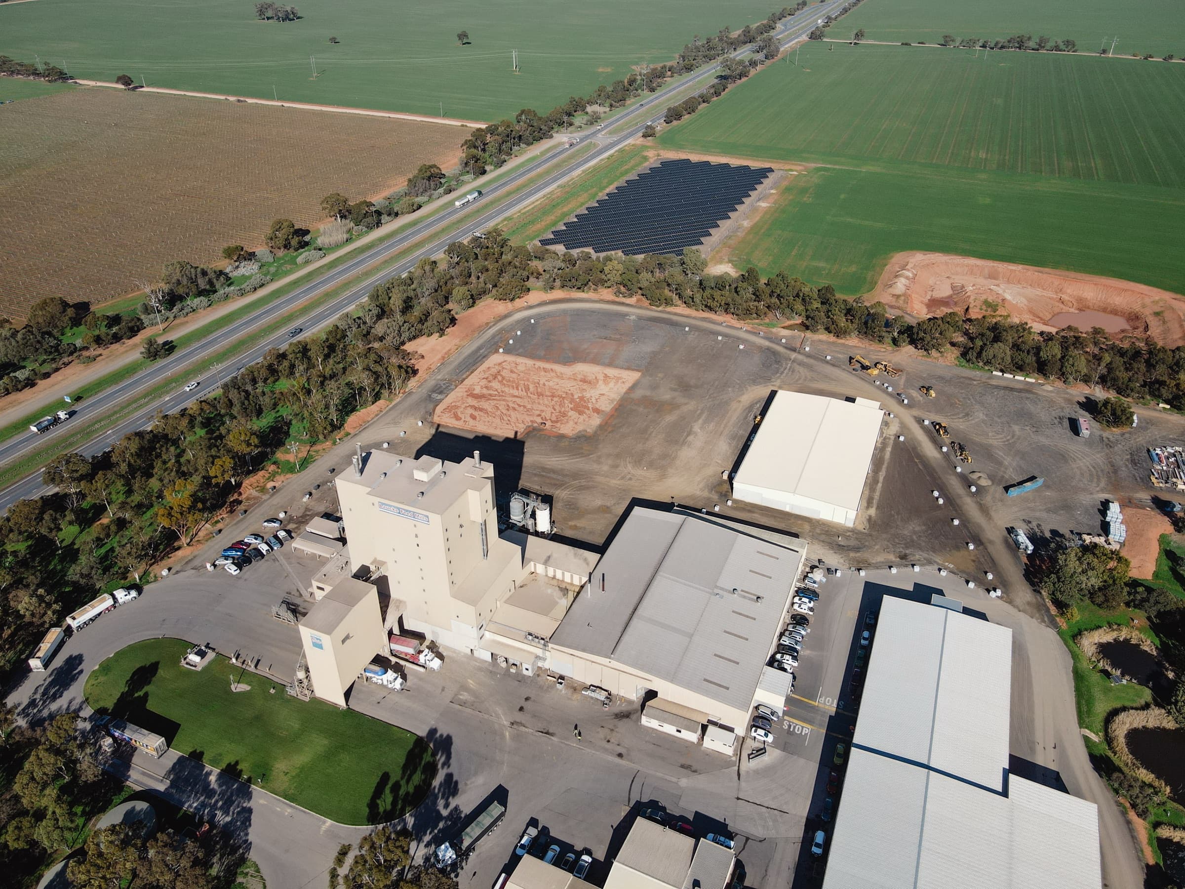 Aerial view of the Laucke Mills site showing the mill buildings with the solar array beyond